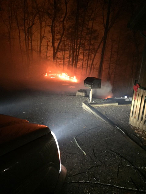 A cabin escapes burning during the Gatlinburg fire