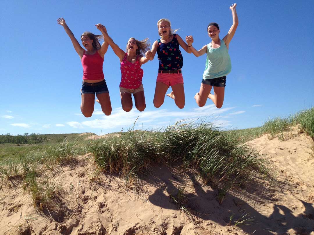 Leaping at the Dune Climb (National Park Services/CC BY 2.0)