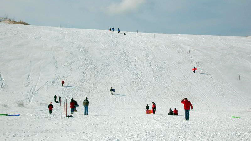 Sledding at the Dune Climb in Sleeping Bear Dunes National Shoreline (National Park Service/CC BY 2.0)